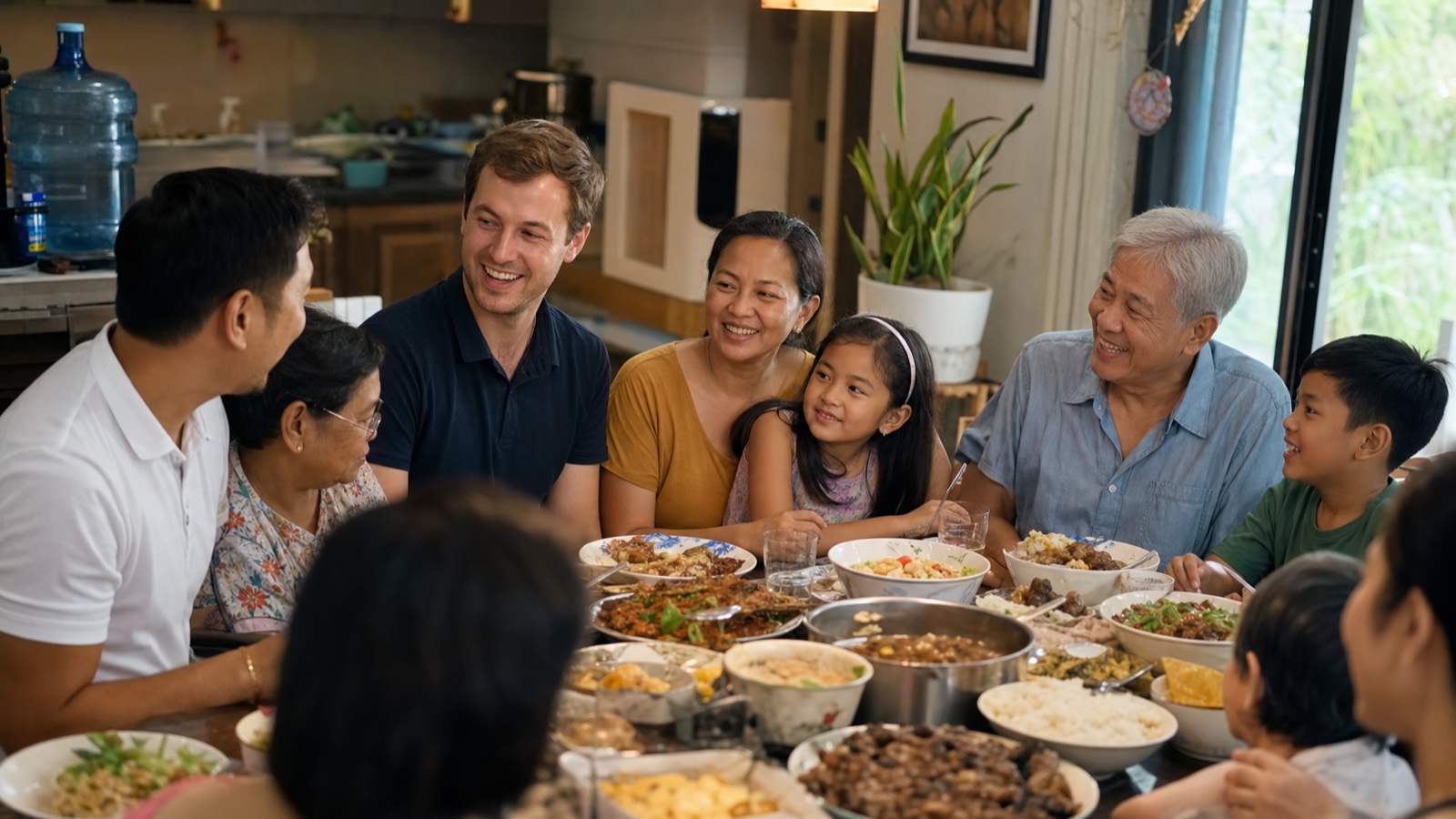 A foreign man welcomed at a big Filipino family Sunday lunch around a full table